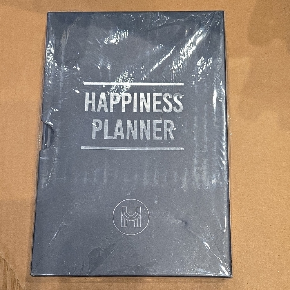 Happiness Planner.  NEVER USED. Still in Packaging.
